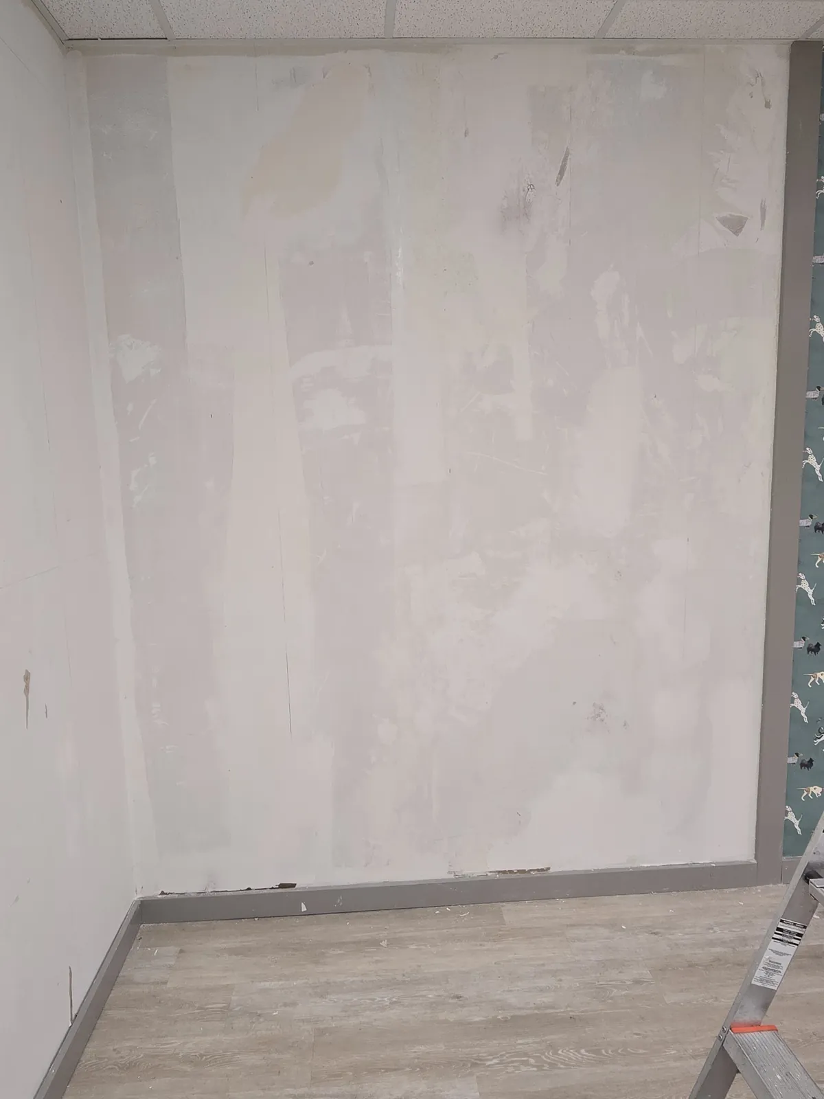 Wall stripped of old wallpaper and prepped clean before new wallpaper installation in Atlanta